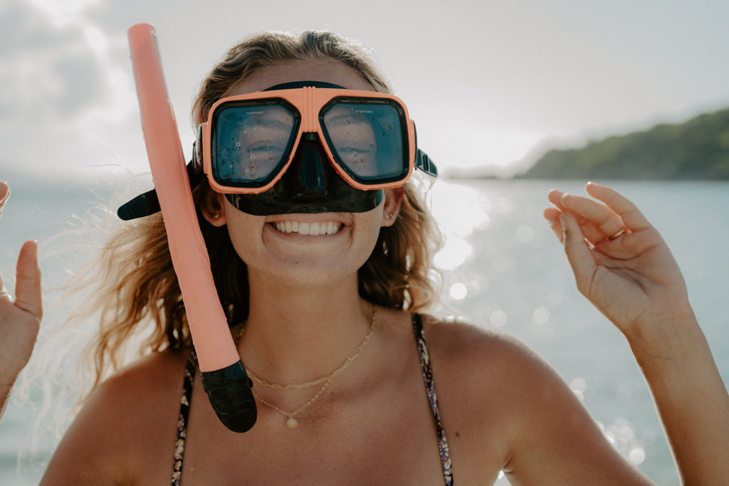 A woman in goggles and a snorkel
