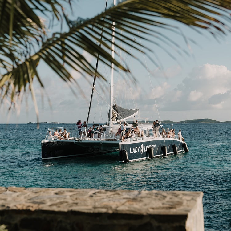 Lovango Bay Virgin Islands Destination, Man and Woman kissing behind a hat