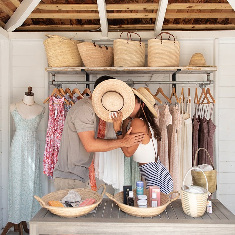 Lovango Bay Virgin Islands Destination, Man and Woman kissing behind a hat