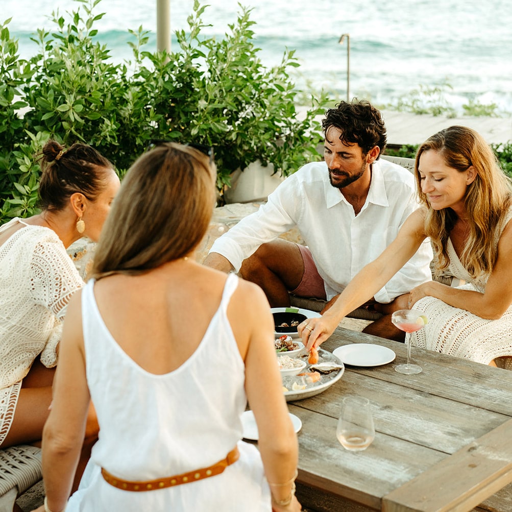 Lovango USVI Fine Dining_0000_People dining outdoors at picnic table on Lovango USVI