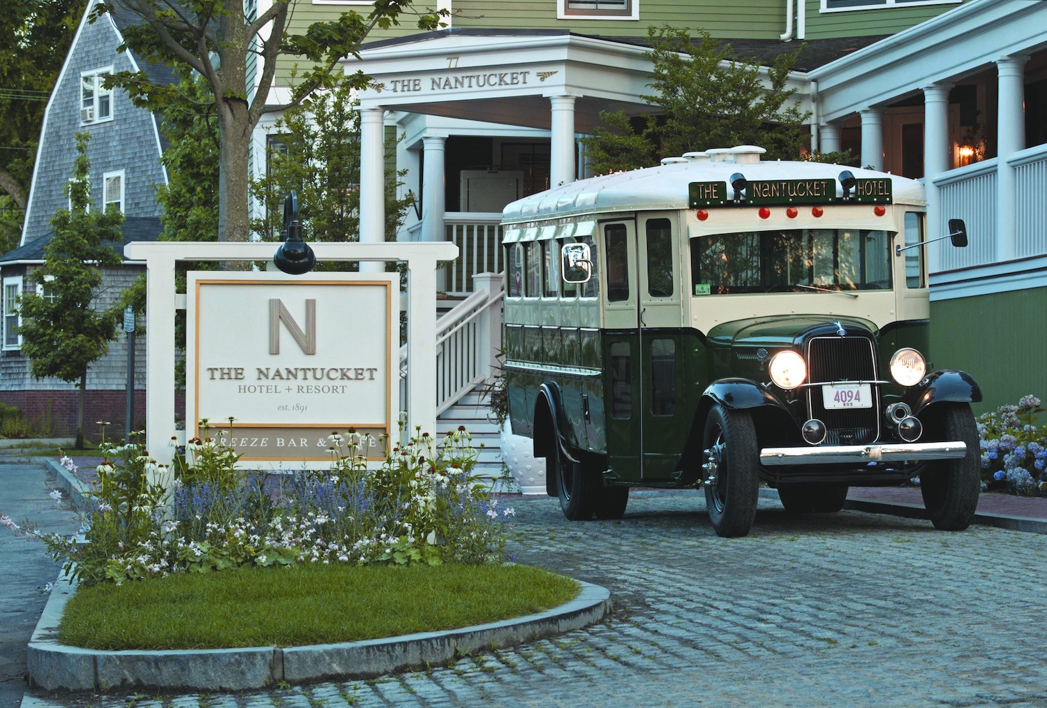 Vintage bus parked outside The Nantucket Hotel & Resort entrance