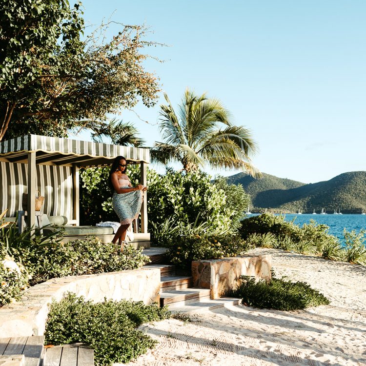 Guest relaxing in a private beachfront cabana at Lovango Resort & Beach Club