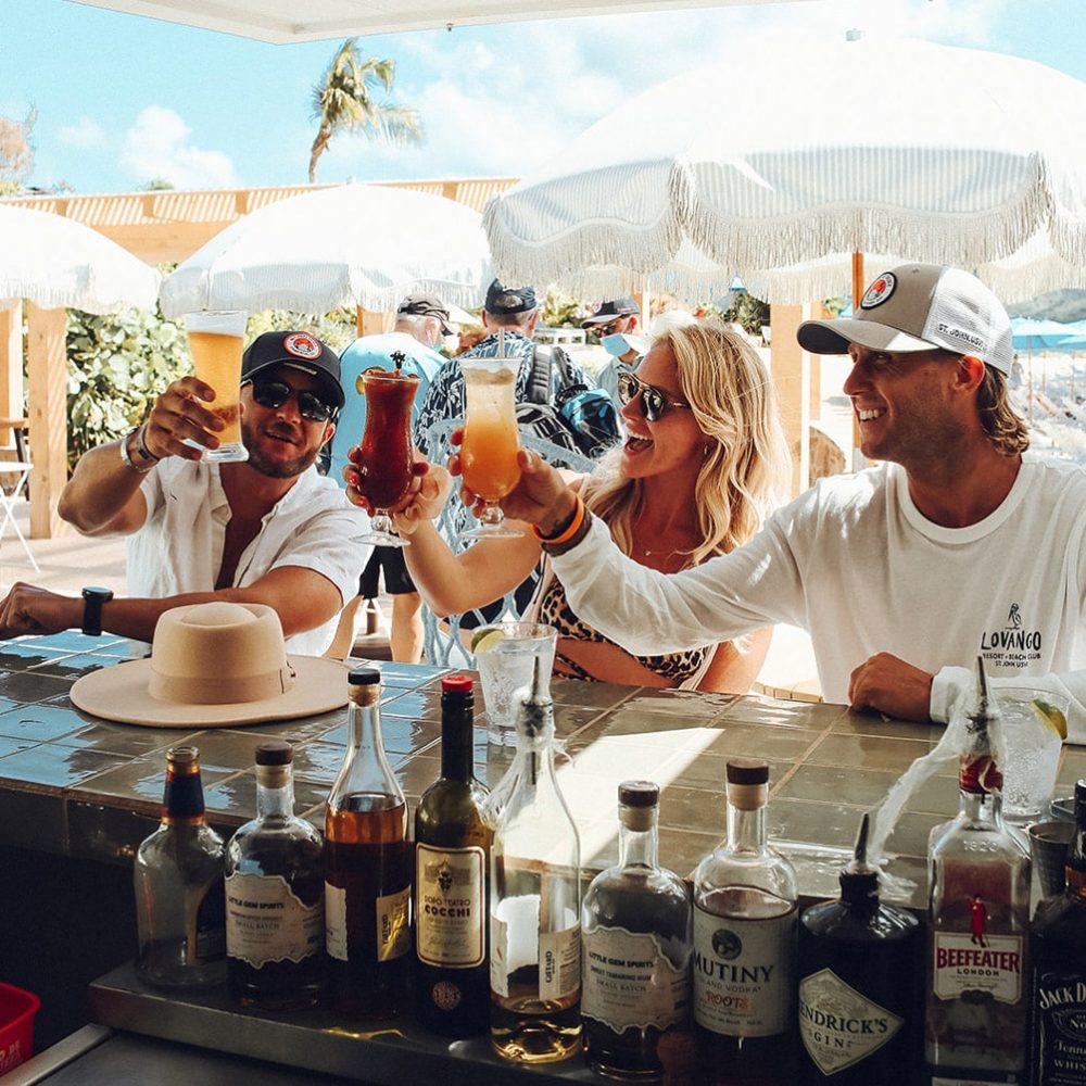 Lovango USVI Fine Dining_0001_A group of people cheers their drinks
