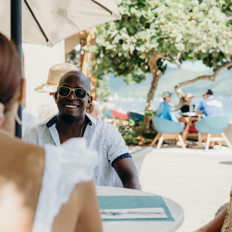 People enjoying outdoor dining at Lovango Resort